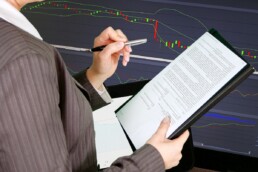Woman making financial inefficiencies visible through analytics systems.
